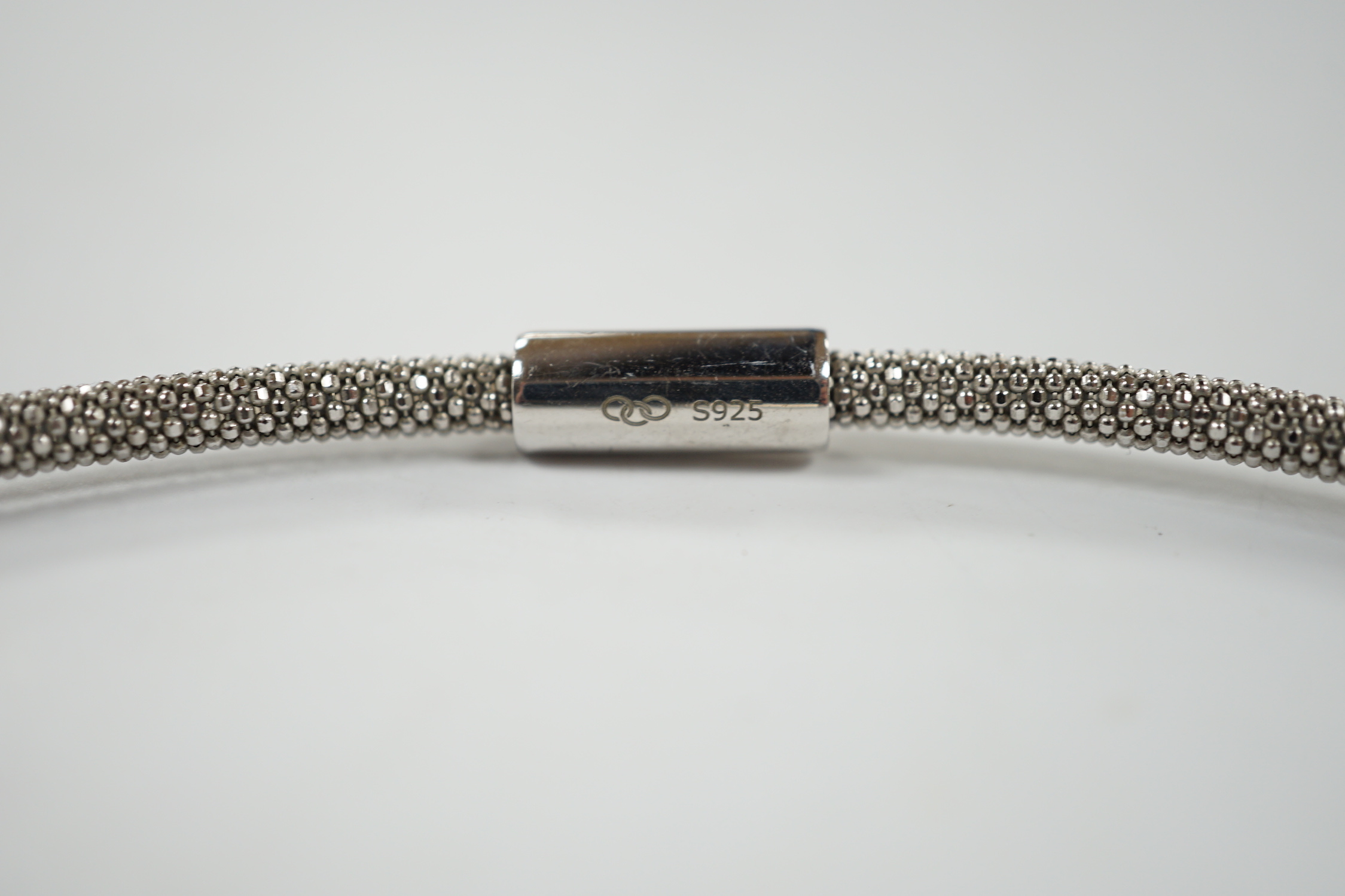A modern Links of London, silver necklace with diamond cluster motif and a similar bracelet, in Links of London box.